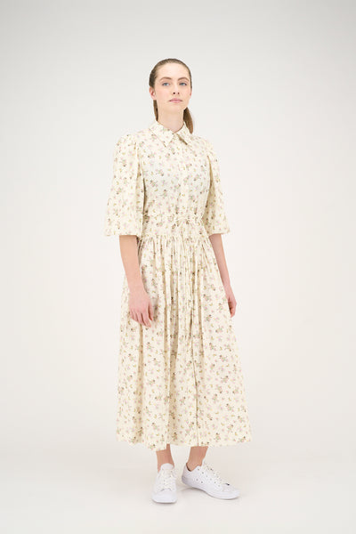 Woman wearing a floral dress on a white background